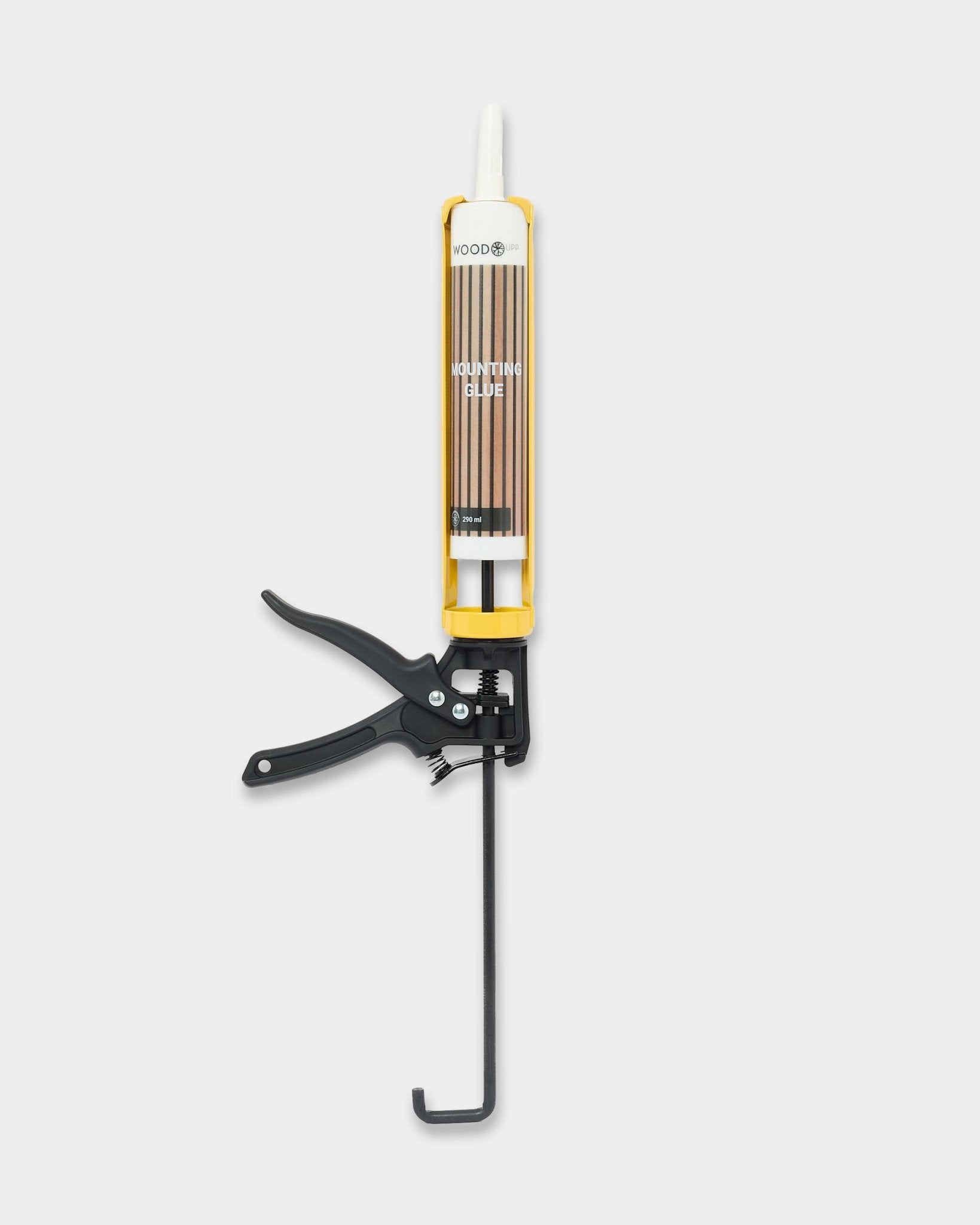 Herramienta de instalación WoodUpp Grout Gun con un cartucho de 290 ml, mostrada sobre un fondo blanco liso, diseñada para paneles acústicos de madera Akupanel.