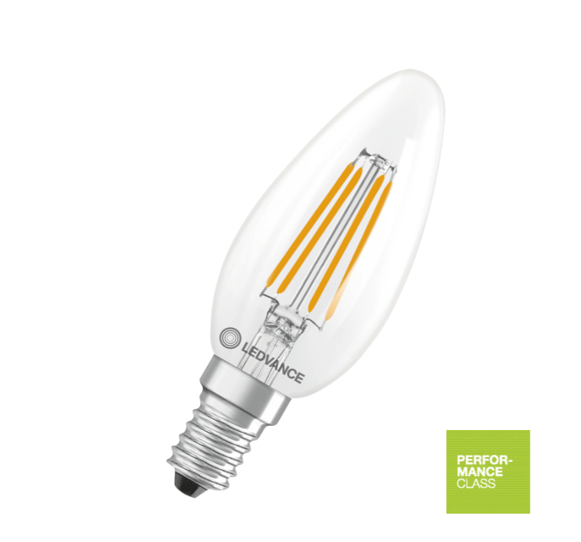 Bombilla LED tipo vela E14 de WoodUpp, 3,4 W, 470 lm; vidrio transparente con filamentos visibles, casquillo plateado de rosca y etiqueta verde de Clase de rendimiento.